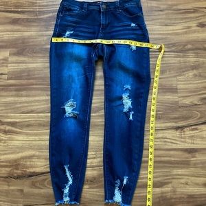 Woman’s distressed, skinny jeans, size 7.